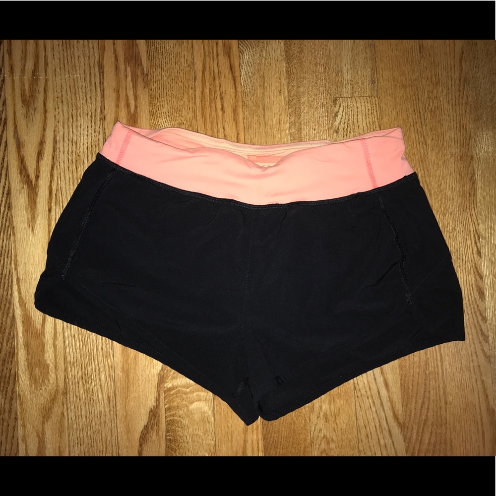 Black running shorts with coral band